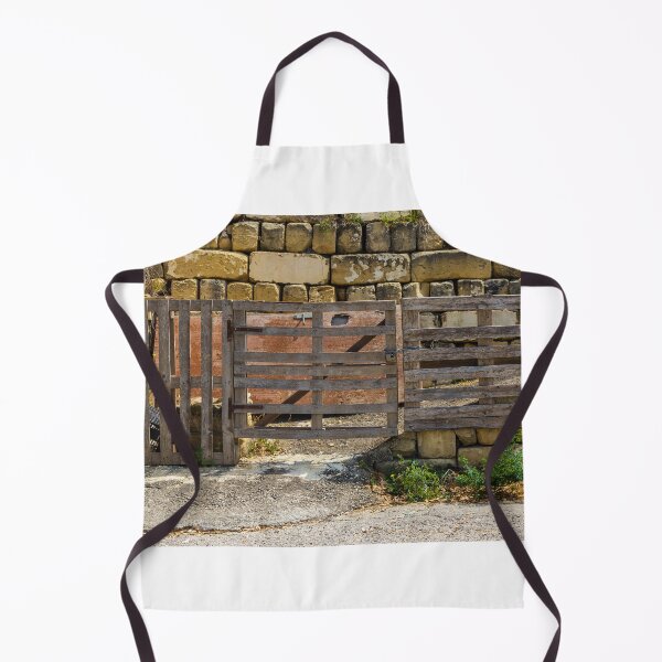 Item preview, Rustic Wooden Gate and Pallet Fence Against Weathered Stone Wall in Rural Farmyard Entrance designed and sold by Nmallia.