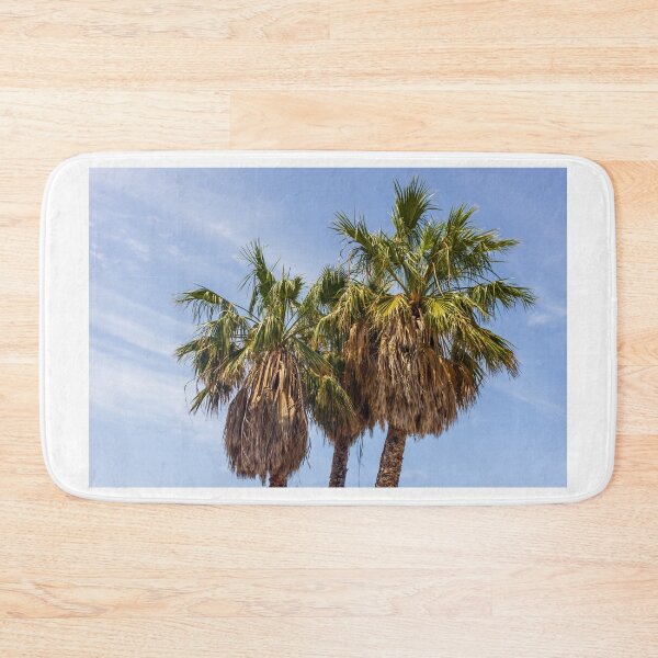 Item preview, Three Palm Trees With Dried Fronds Against A Clear Blue Sky On Sunny Day designed and sold by Nmallia.