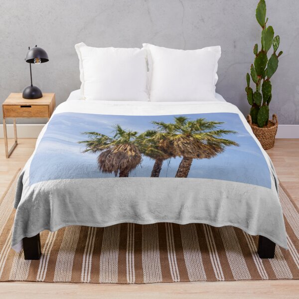 Item preview, Three Palm Trees With Dried Fronds Against A Clear Blue Sky On Sunny Day designed and sold by Nmallia.