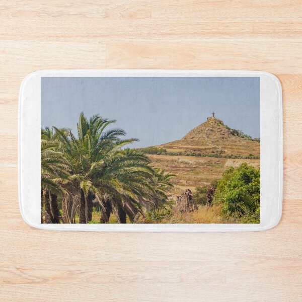 Item preview, Palm Trees Framing a Rocky Hill With a Cross Monument Overlooking Arid Rural Landscape designed and sold by Nmallia.