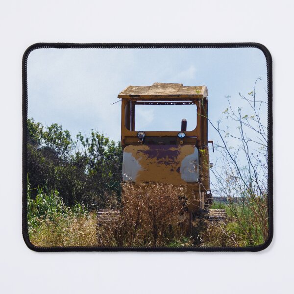 Item preview, Abandoned Yellow Bulldozer Overgrown in Field Under Blue Sky, Rusted Construction Machinery designed and sold by Nmallia.