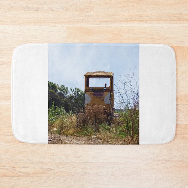 Item preview, Abandoned Yellow Bulldozer Overgrown in Field Under Blue Sky, Rusted Construction Machinery designed and sold by Nmallia.