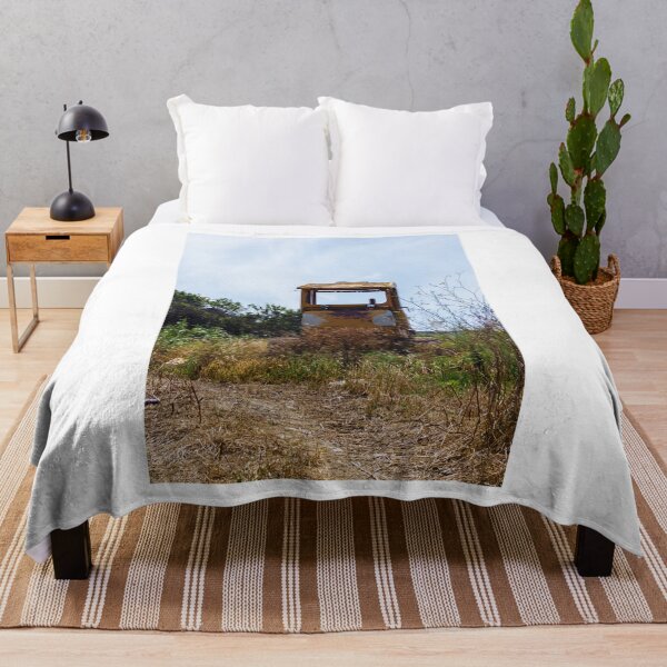 Item preview, Abandoned Yellow Bulldozer Overgrown in Field Under Blue Sky, Rusted Construction Machinery designed and sold by Nmallia.