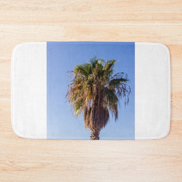 Item preview, Tall Palm Tree With Dry Fronds Against Clear Blue Sky On A Sunny Day designed and sold by Nmallia.