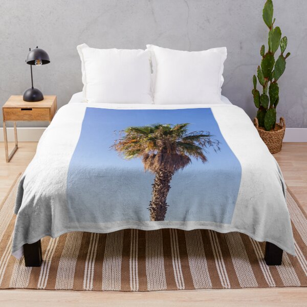Item preview, Tall Palm Tree With Dry Fronds Against Clear Blue Sky On A Sunny Day designed and sold by Nmallia.