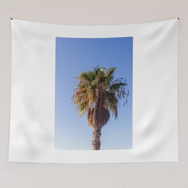 Item preview, Tall Palm Tree With Dry Fronds Against Clear Blue Sky On A Sunny Day designed and sold by Nmallia.