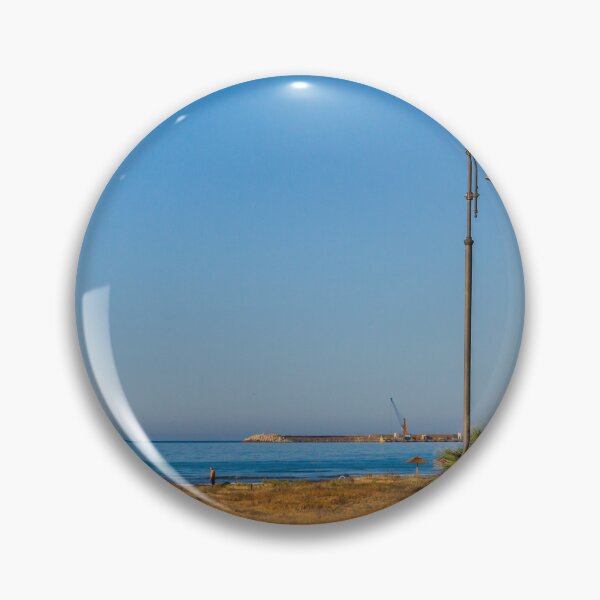 Item preview, Coastal Promenade Lamp Post Overlooking Calm Sea, Sandy Dunes and Distant Harbor Cranes at Sunrise designed and sold by Nmallia.