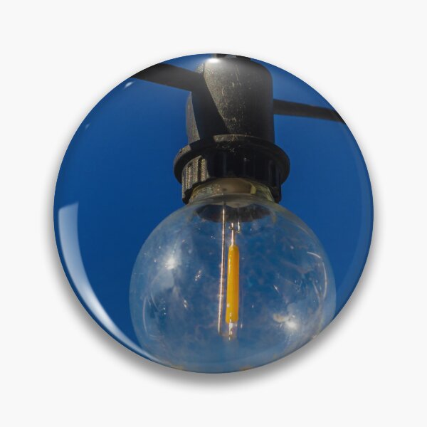 Item preview, Outdoor String Light Bulb Hanging Against Clear Blue Sky For Patio Ambience designed and sold by Nmallia.