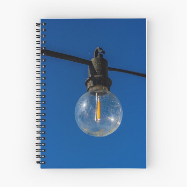 Item preview, Outdoor String Light Bulb Hanging Against Clear Blue Sky For Patio Ambience designed and sold by Nmallia.