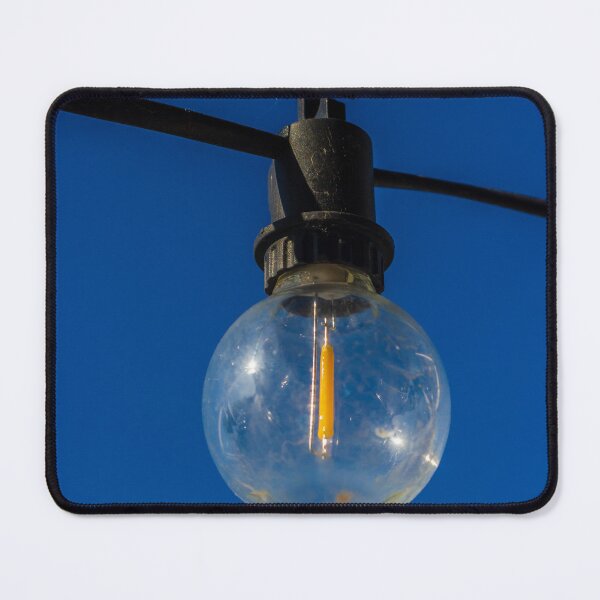 Item preview, Outdoor String Light Bulb Hanging Against Clear Blue Sky For Patio Ambience designed and sold by Nmallia.