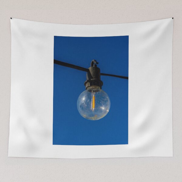 Item preview, Outdoor String Light Bulb Hanging Against Clear Blue Sky For Patio Ambience designed and sold by Nmallia.