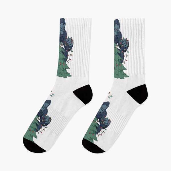Item preview, Bigfoot Decorating the Christmas Tree - Funny Sasquatch Holiday T-Shirt designed and sold by Whimsy Trail Co.