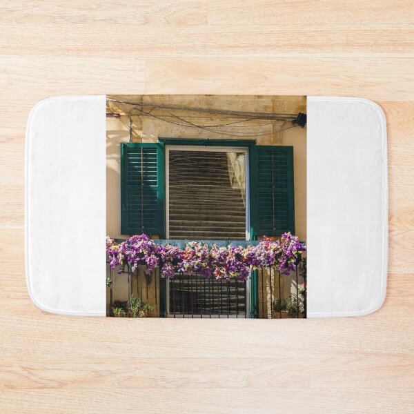 Item preview, Sunlit Balcony With Purple Flowers And Green Shutters On Rustic Mediterranean Stone Building designed and sold by Nmallia.
