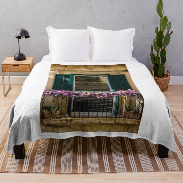 Item preview, Sunlit Balcony With Purple Flowers And Green Shutters On Rustic Mediterranean Stone Building designed and sold by Nmallia.