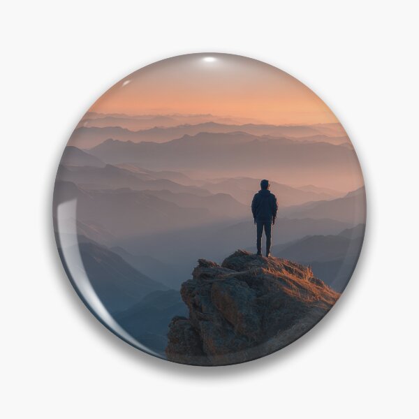 Item preview, Majestic Mountain Peak Sunset Hiker Silhouette Wall Art Standing Above Misty Horizon Landscape Photography Print in Golden Hour Orange and Misty Blue Tones designed and sold by SurfaceCraft Studio.