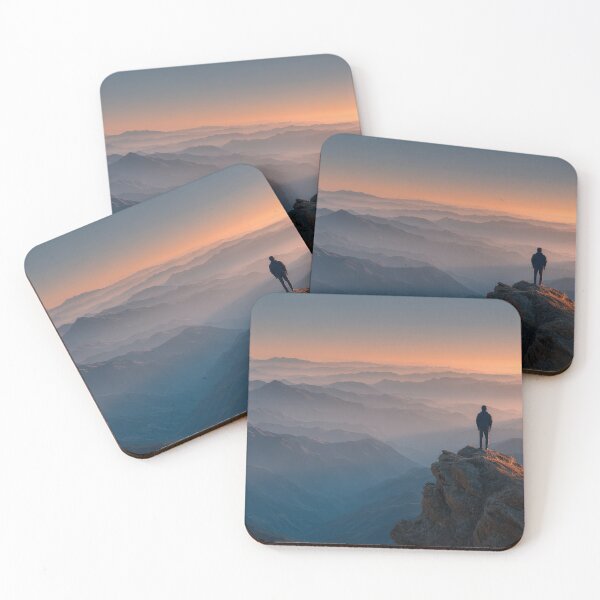 Item preview, Majestic Mountain Peak Sunset Hiker Silhouette Wall Art Standing Above Misty Horizon Landscape Photography Print in Golden Hour Orange and Misty Blue Tones designed and sold by SurfaceCraft Studio.