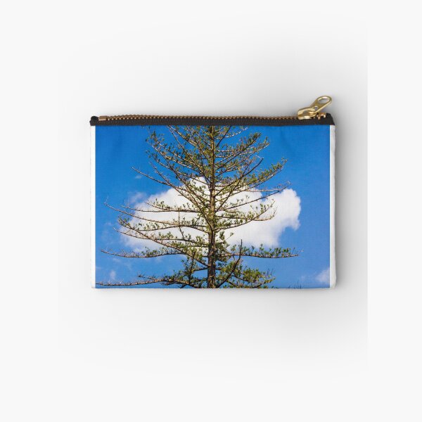 Item preview, Tall Pine Tree Against Bright Blue Sky With White Cloud and Sparse Branches in Nature designed and sold by Nmallia.