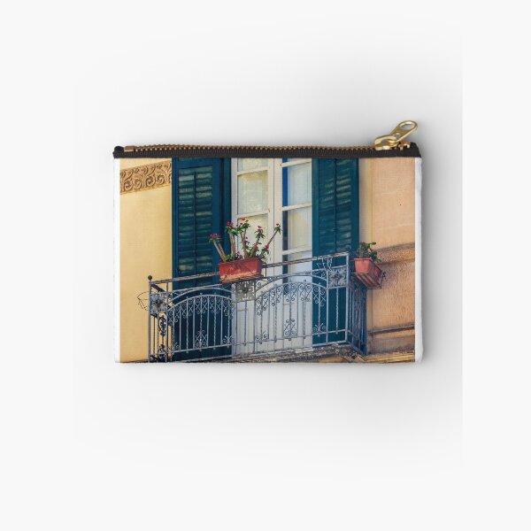 Item preview, Ornate Mediterranean Balcony With Wrought-Iron Railing, Blue Shutters and Potted Flowers on Historic Facade designed and sold by Nmallia.
