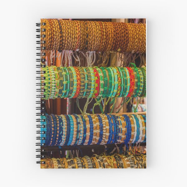 Item preview, Colorful Handmade Woven Bracelets Displayed on Wooden Rack in Artisan Market Jewelry Stall designed and sold by Nmallia.