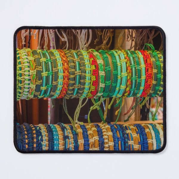 Item preview, Colorful Handmade Woven Bracelets Displayed on Wooden Rack in Artisan Market Jewelry Stall designed and sold by Nmallia.