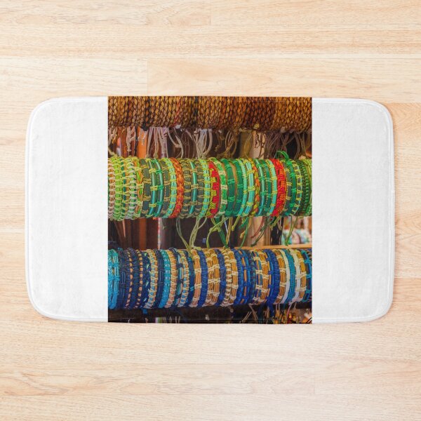 Item preview, Colorful Handmade Woven Bracelets Displayed on Wooden Rack in Artisan Market Jewelry Stall designed and sold by Nmallia.