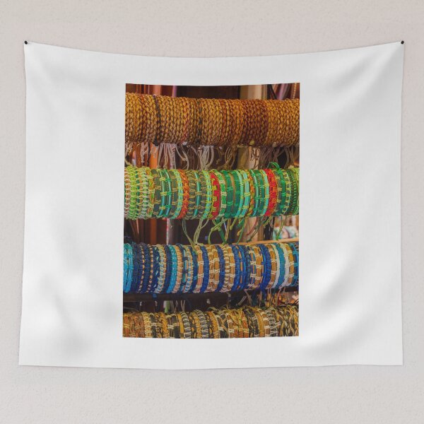 Item preview, Colorful Handmade Woven Bracelets Displayed on Wooden Rack in Artisan Market Jewelry Stall designed and sold by Nmallia.