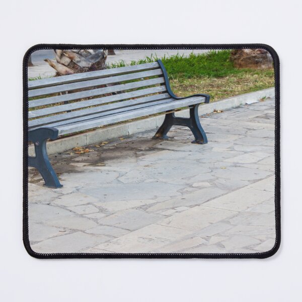 Item preview, Empty Park Bench on Stone Pavement Near Palm Trees in Urban Outdoor Public Space designed and sold by Nmallia.