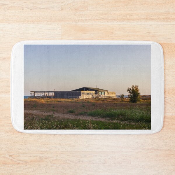 Item preview, Abandoned Wooden Beach Shack on Seaside Dunes at Sunset With Wild Grass and Calm Sea designed and sold by Nmallia.