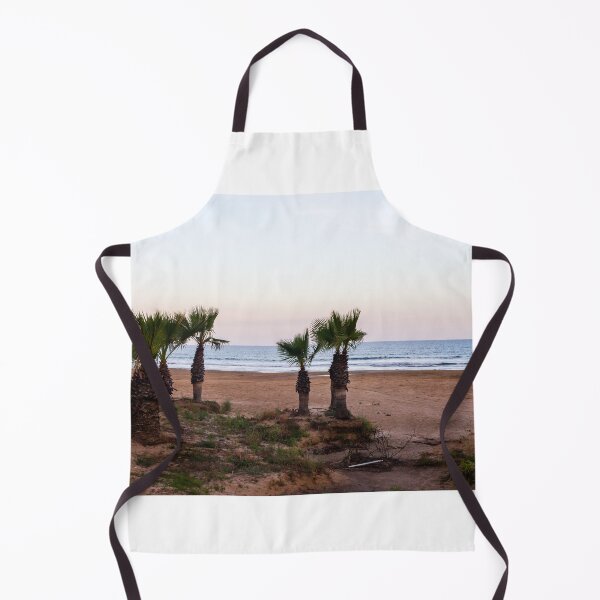 Item preview, Tranquil Beach With Palm Trees Along Sandy Shoreline at Pastel Sunrise Over Calm Sea designed and sold by Nmallia.