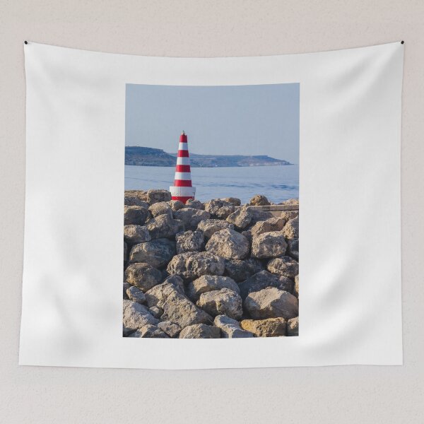 Item preview, Red and White Striped Lighthouse on Rocky Breakwater by Calm Sea with Distant Coastline designed and sold by Nmallia.