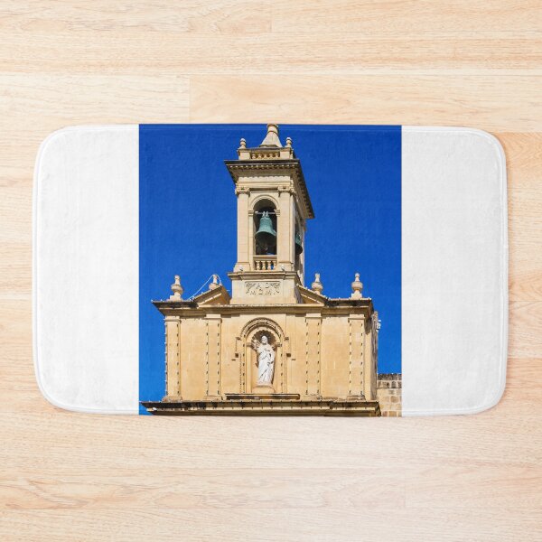 Item preview, Historic Church Bell Tower With Statue, Cross and Bronze Bells Against Clear Blue Sky designed and sold by Nmallia.