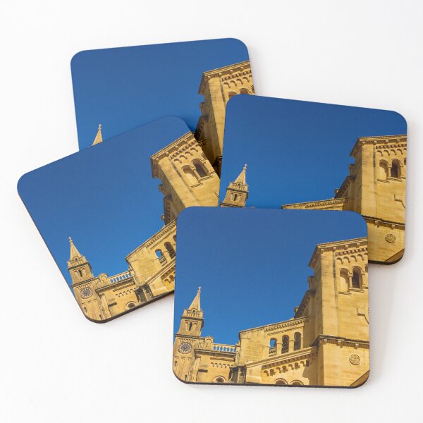 Item preview, Historic Stone Cathedral Facade With Clock Tower And Rose Window Against A Clear Blue Sky designed and sold by Nmallia.