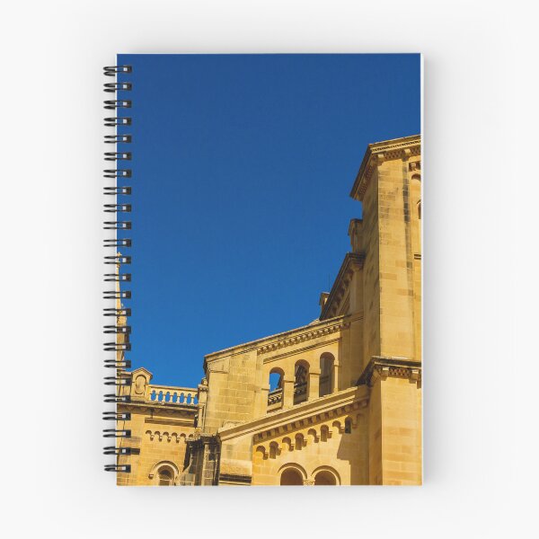 Item preview, Historic Stone Cathedral Facade With Clock Tower And Rose Window Against A Clear Blue Sky designed and sold by Nmallia.