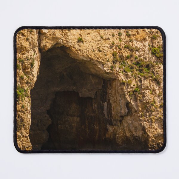 Item preview, Small Boat Anchored in Sea Grotto Beneath Sunlit Limestone Cliff With Green Water Reflections designed and sold by Nmallia.