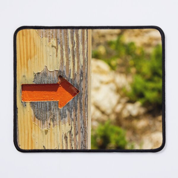 Item preview, Weathered Wooden Post With Orange Arrow Direction Sign Pointing Right On Outdoor Trail designed and sold by Nmallia.