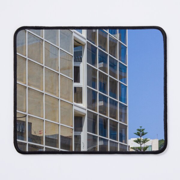 Item preview, Modern Glass Building Facade With Reflective Windows, Blue Sky and Urban Architectural Detail designed and sold by Nmallia.
