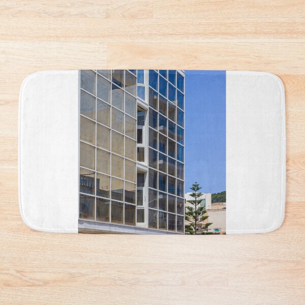 Item preview, Modern Glass Building Facade With Reflective Windows, Blue Sky and Urban Architectural Detail designed and sold by Nmallia.