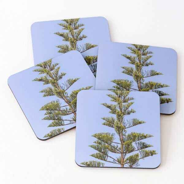 Item preview, Tall Pine Tree Top Against Clear Blue Sky With Layered Branches And Green Needles designed and sold by Nmallia.