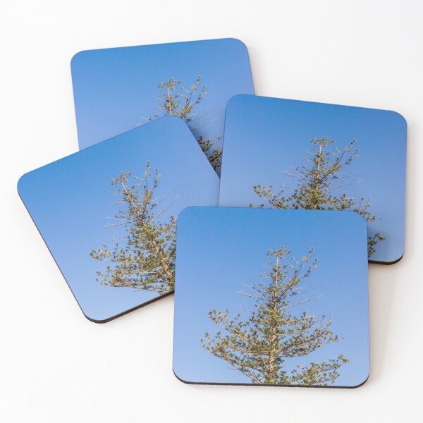 Item preview, Tall Pine Tree Top Against Clear Blue Sky With Layered Branches And Green Needles designed and sold by Nmallia.