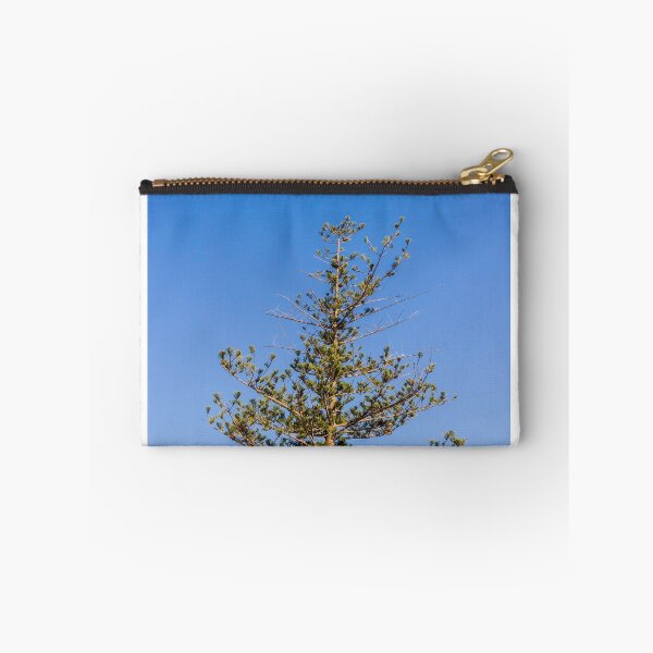 Item preview, Tall Pine Tree Top Against Clear Blue Sky With Layered Branches And Green Needles designed and sold by Nmallia.