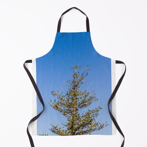Item preview, Tall Pine Tree Top Against Clear Blue Sky With Layered Branches And Green Needles designed and sold by Nmallia.
