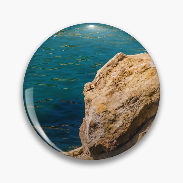Item preview, Turquoise Sea Water and Sunlit Coastal Rocks on a Rocky Cliff by the Shoreline designed and sold by Nmallia.