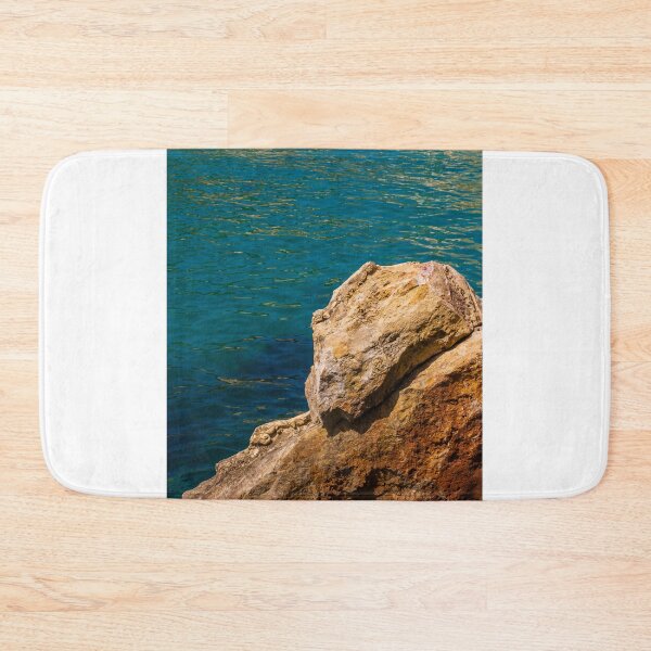 Item preview, Turquoise Sea Water and Sunlit Coastal Rocks on a Rocky Cliff by the Shoreline designed and sold by Nmallia.