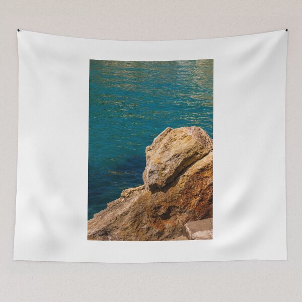 Item preview, Turquoise Sea Water and Sunlit Coastal Rocks on a Rocky Cliff by the Shoreline designed and sold by Nmallia.