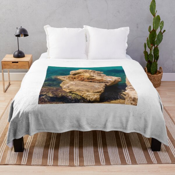 Item preview, Turquoise Sea Water and Sunlit Coastal Rocks on a Rocky Cliff by the Shoreline designed and sold by Nmallia.