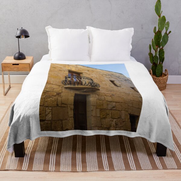Item preview, Old Stone Building With Wrought Iron Balcony And Wooden Window On Sunny Day designed and sold by Nmallia.
