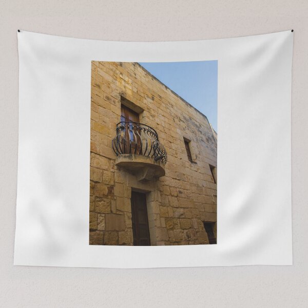 Item preview, Old Stone Building With Wrought Iron Balcony And Wooden Window On Sunny Day designed and sold by Nmallia.