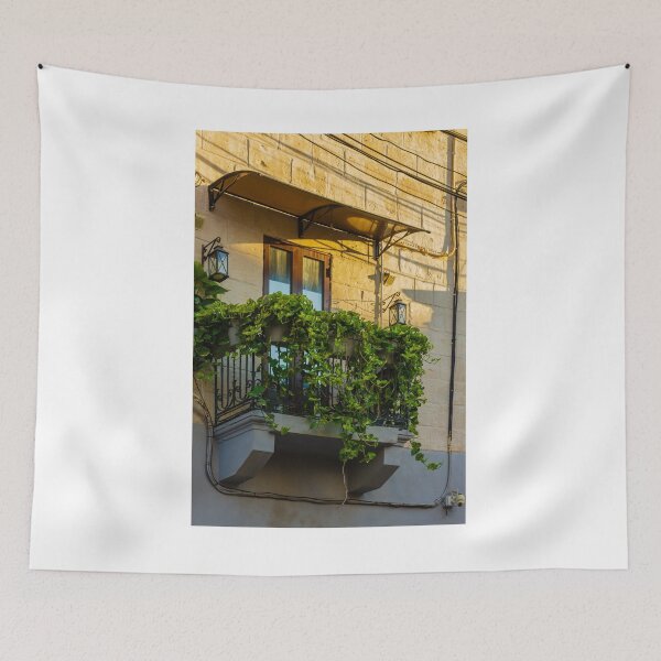 Item preview, Sunlit Balcony With Lush Green Vines Draping Over Iron Railing And Wooden Doors designed and sold by Nmallia.
