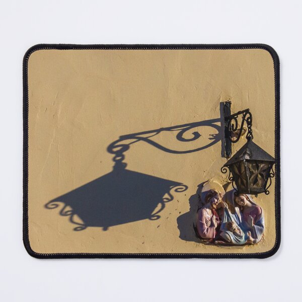 Item preview, Ceramic Nativity Plaque With Metal Lantern Casting Dramatic Shadow On Sunlit Yellow Wall designed and sold by Nmallia.