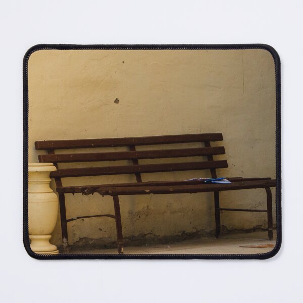 Item preview, Empty Rustic Bench Against a Weathered Wall in a Quiet Urban Corner designed and sold by Nmallia.